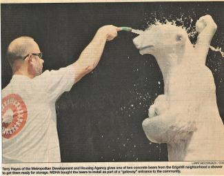 Tennessean clipping from 2003, showing an MDHA employee cleaning one of the bears